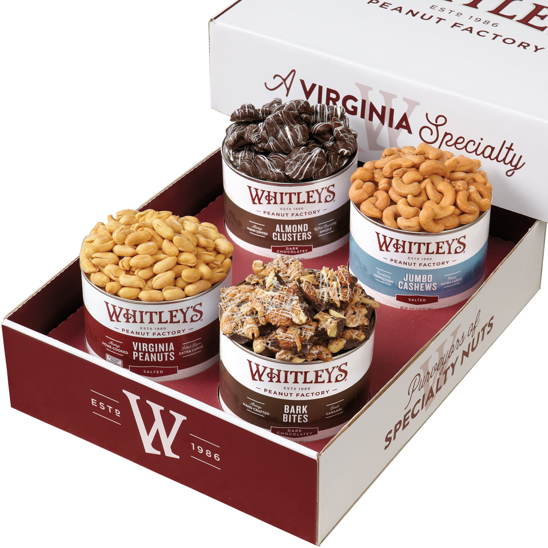 20 oz. Tin Salted Virginia Peanuts, 12 oz. Tin Dark Chocolatey Bark Bites, 16 oz. Tin Dark Chocolatey Almond Clusters, 18 oz. Tin Salted Jumbo Cashews in a Whitley’s branded gift box.